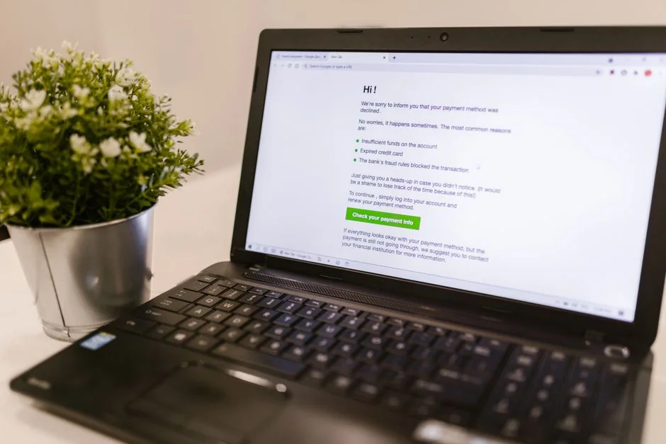 Focused business analysis with charts and graphs on a laptop in a modern office setting.